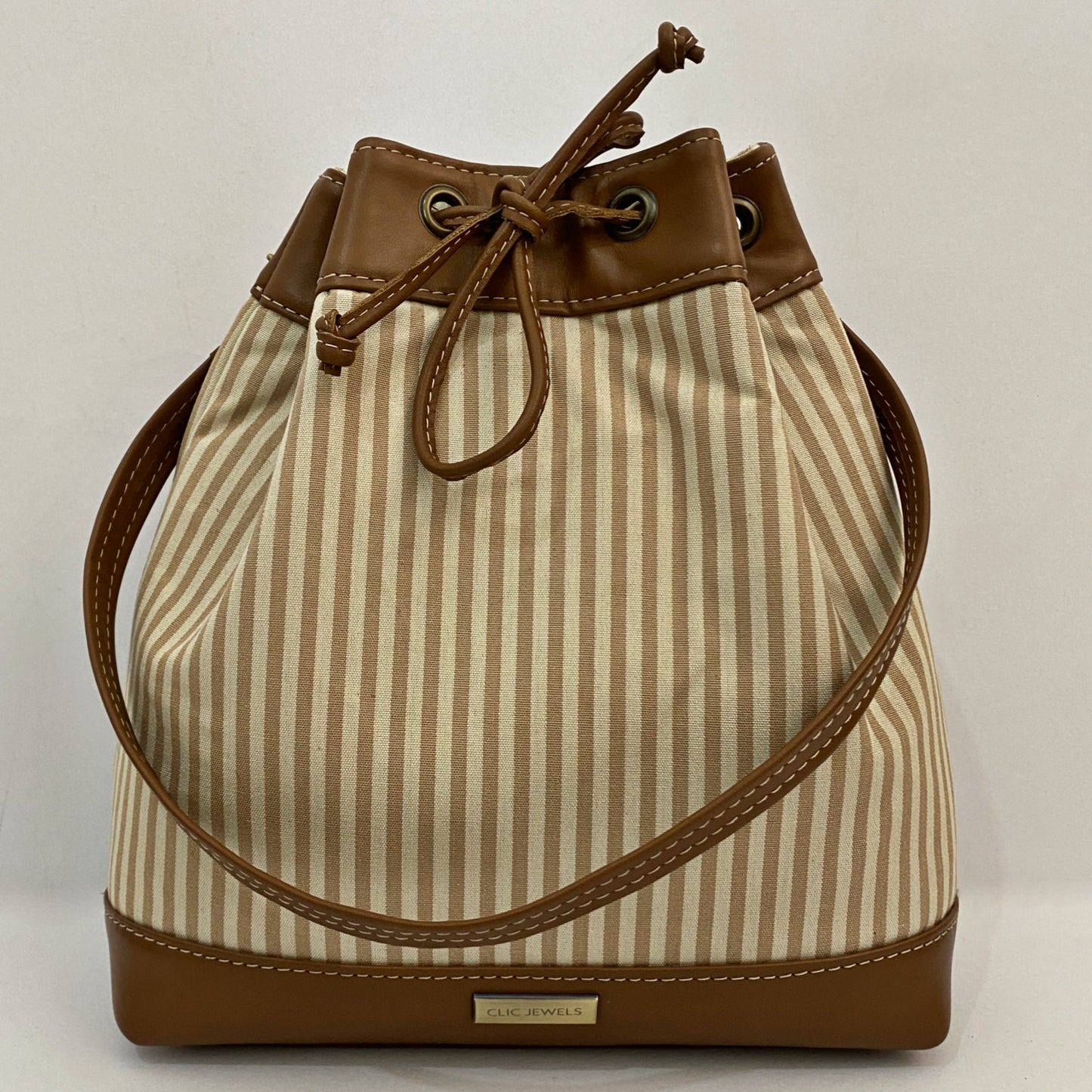 BUCKETBAG/BACKPACK (stripes fabric & leather details)